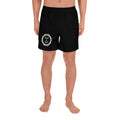 A person modeling black athletic shorts with a white circular thorn crown graphic and the words 'Good with God' on the right leg, shown against a plain white background.