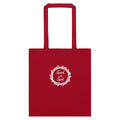 A red canvas tote bag with two top handles, featuring a white circular graphic on the front that reads 'Good with God' inside a crown of thorns design, shown against a plain white background.