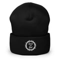 Black beanie with a white logo on a white background