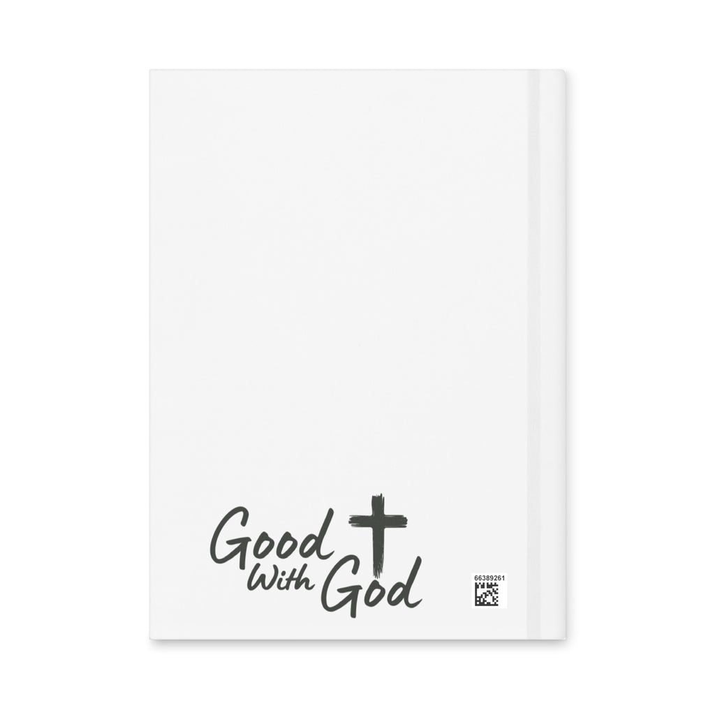 A white hardcover notebook with the words 'Good with God' and a black cross printed on the front cover, shown against a plain white background.