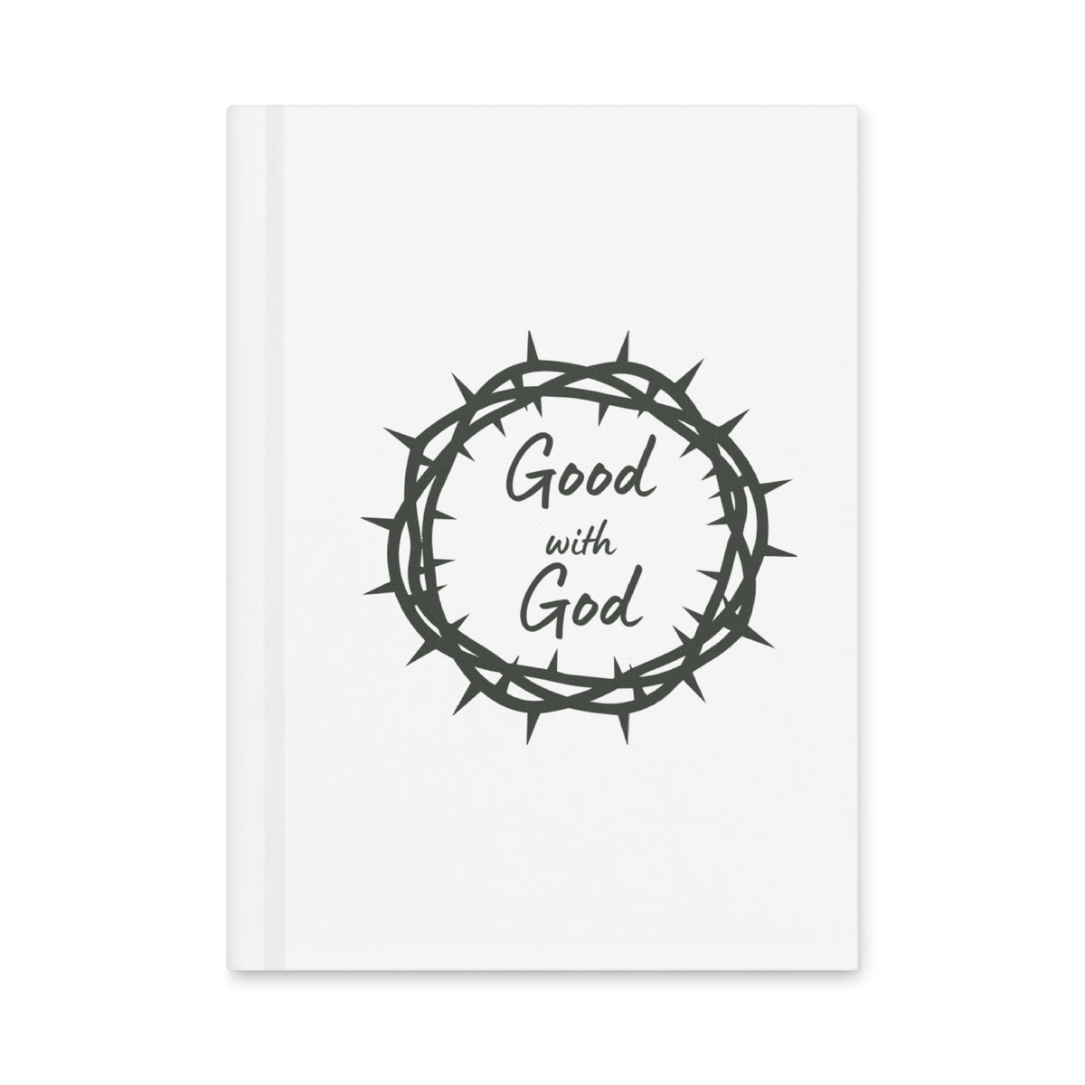 A white hardcover notebook featuring a dark gray graphic of a crown of thorns with the words 'Good with God' written inside, shown on a clean white background.