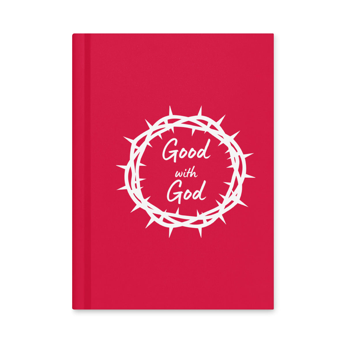 A bright pink hardcover notebook or journal with a white graphic of a crown of thorns surrounding the words 'Good with God' in white script, shown on a plain white background.