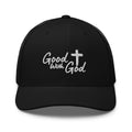 Black Yupoong 6606 retro trucker hat with white embroidered Good With God Christian logo and cross on structured front panel.