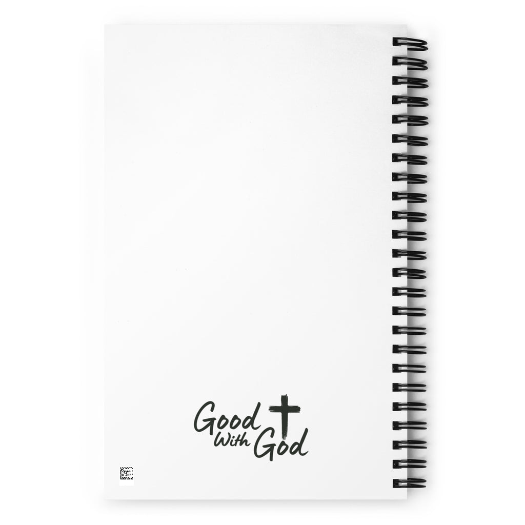 White notebook with black spiral binding and 'Good with God' logo on a white background