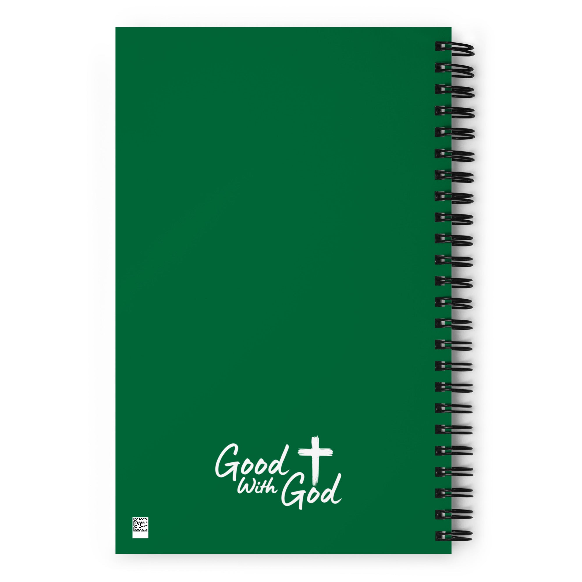 A green spiral-bound notebook with a black wire coil on the right side and white text reading 'Good with God' with a cross symbol near the bottom, shown on a white background.