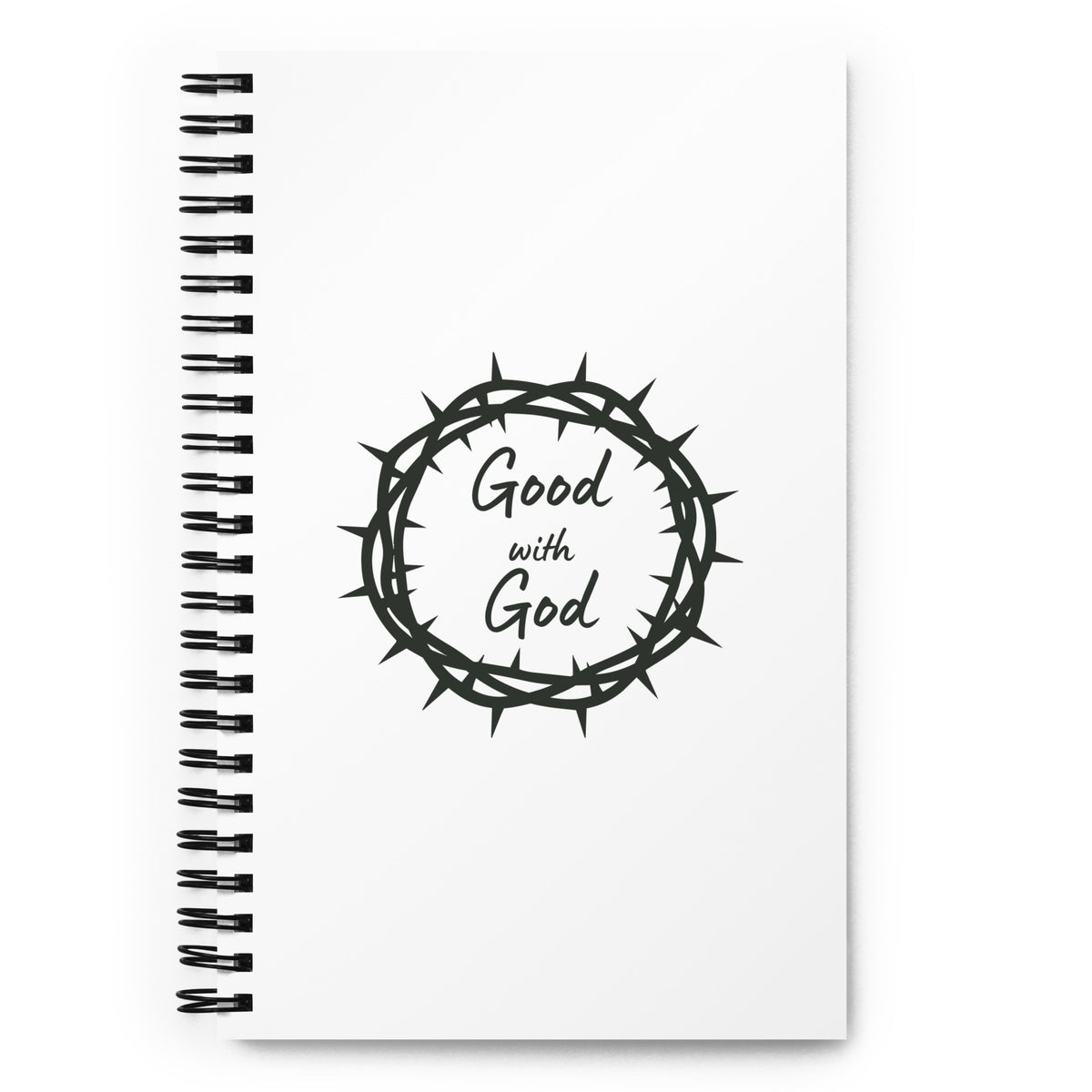 A white spiral-bound notebook with a black wire binding and a black graphic on the cover showing a crown of thorns with the words 'Good with God' inside.