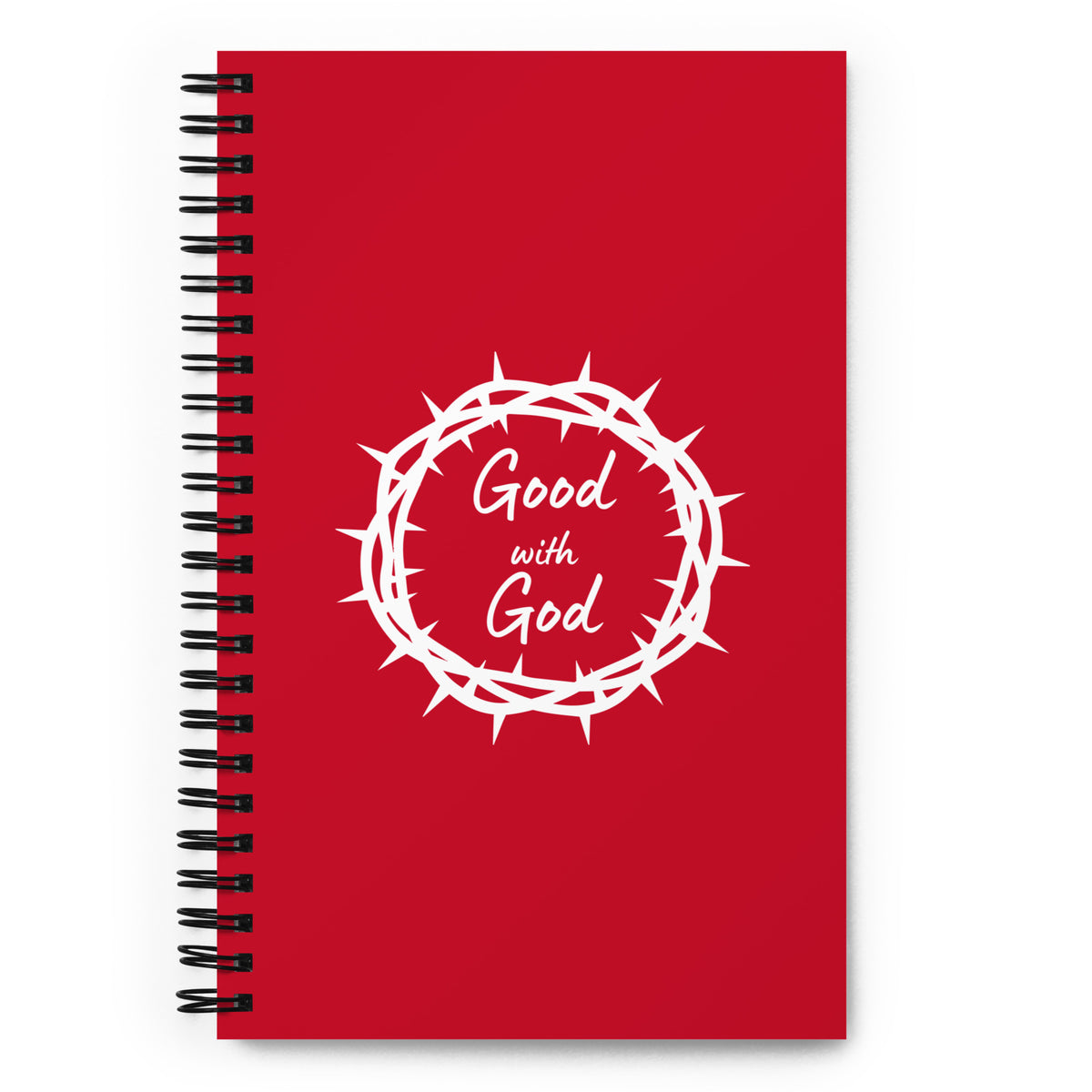 A red spiral-bound notebook with a black wire binding and a white graphic of a crown of thorns surrounding the words 'Good with God' in script, shown on a plain white background.