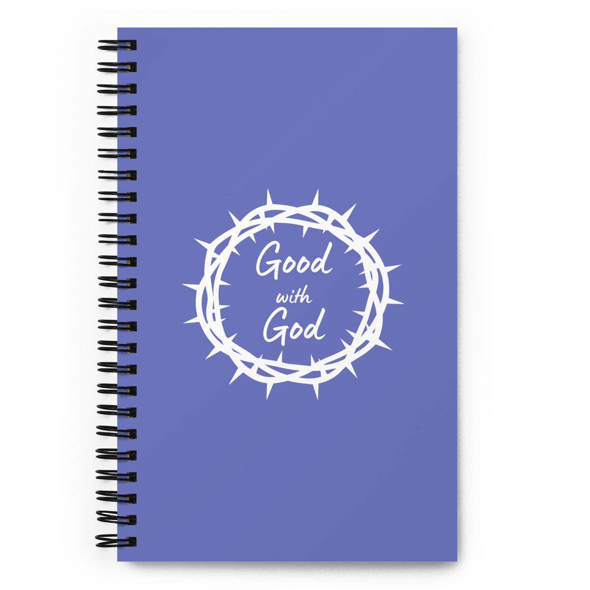 A blue-purple spiral notebook with a black wire binding and a white graphic of a crown of thorns surrounding the words 'Good with God' on the cover, shown on a white background.