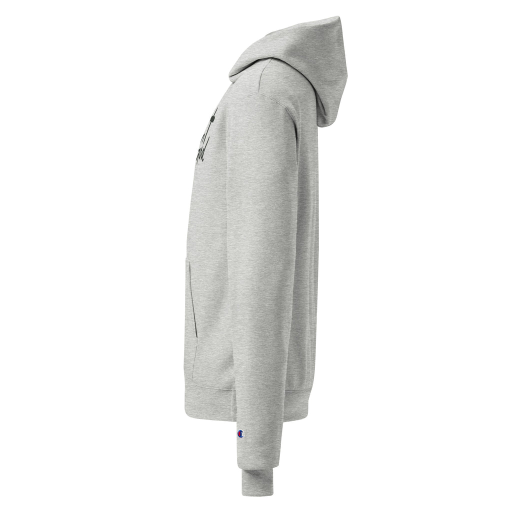 Side view of heather grey Unisex Champion Powerblend Hoodie showcasing the iconic Champion C logo embroidered on the left wrist cuff.