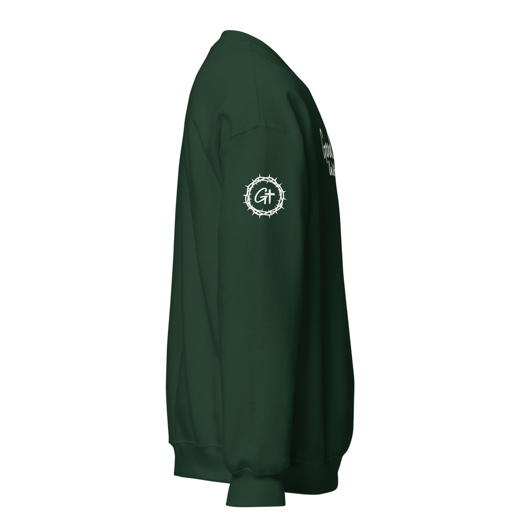 Right sleeve detail of green Good With God crew neck sweatshirt featuring printed white crown of thorns logo with cross.