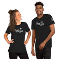 Two people wearing charcoal t-shirts with a mountain and 'Good with God' design on a white background