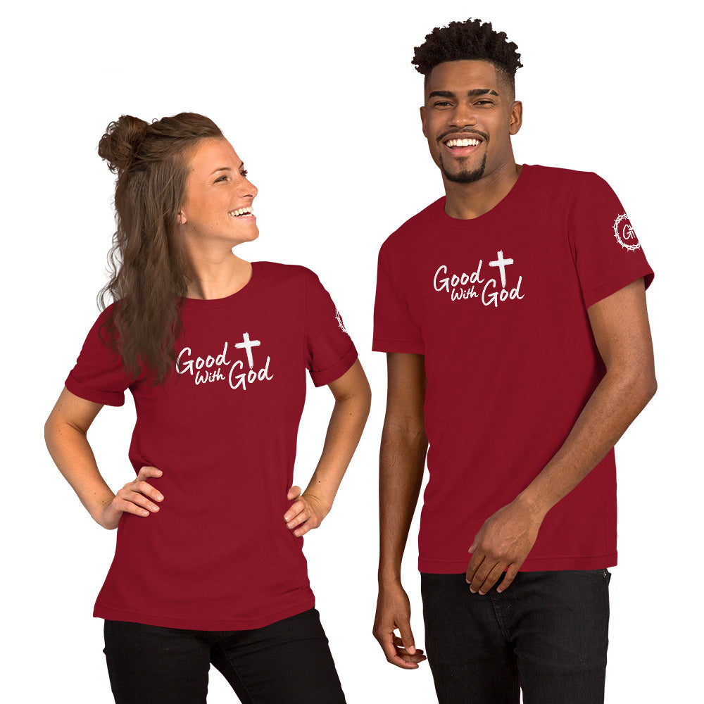 Two people wearing red t-shirts with a mountain and 'Good with God' design on a white background