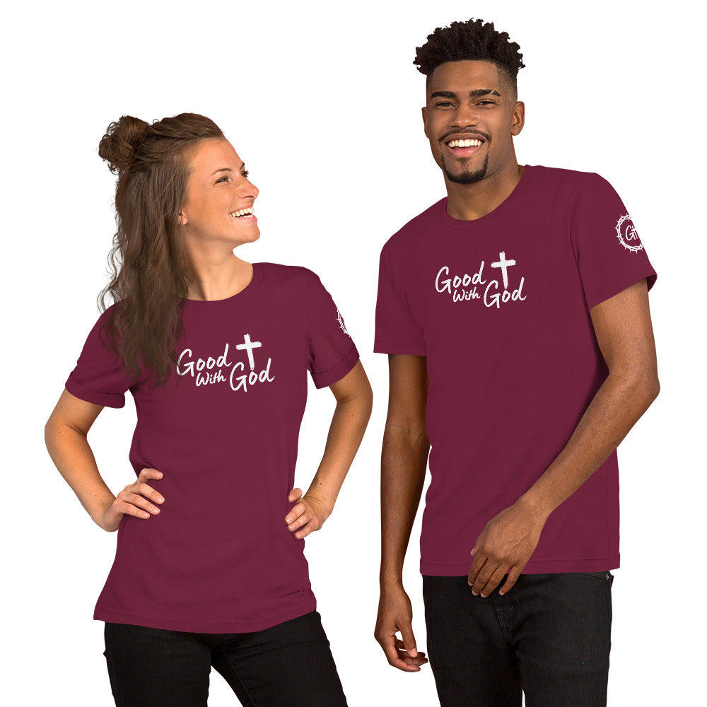 Two people wearing maroon t-shirts with a mountain and 'Good with God' design on a white background