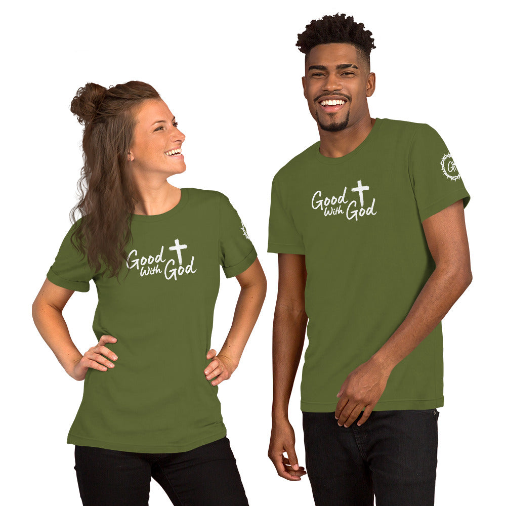 Two people wearing green t-shirts with a mountain and 'Good with God' design on a white background